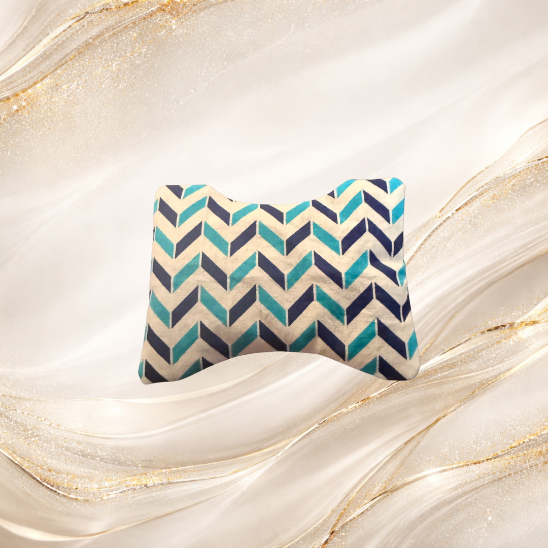 Small Palm & Pulse™ Comfort Compress with a tidal chevron pattern in shades of blue and teal, filled with natural buckwheat hulls for hot or cold therapy.