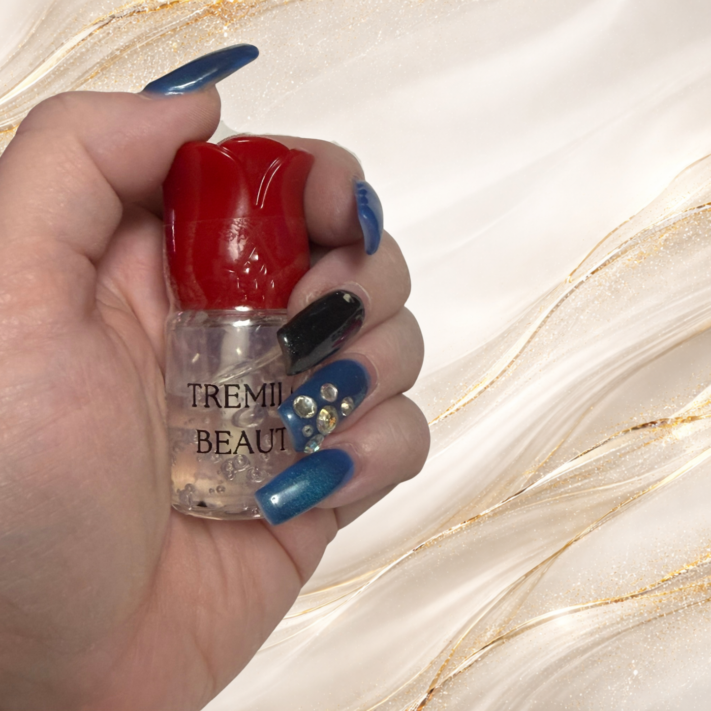 Hand holding Crystal Veil clear lip gloss in rose-shaped tube from Tremilo Beauty Steel City Gloss collection