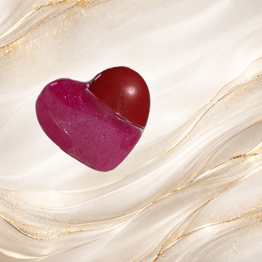 Tremilo South Side Pop lip gloss in heart-shaped tube with vibrant pink shimmer gloss