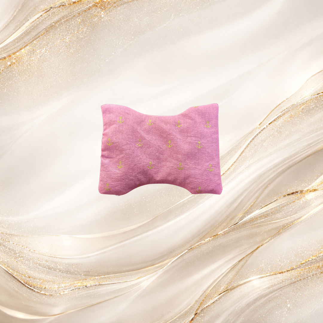 Small Palm & Pulse™ Comfort Compress in pink with gold anchors, filled with natural buckwheat hulls for targeted hot or cold therapy.
