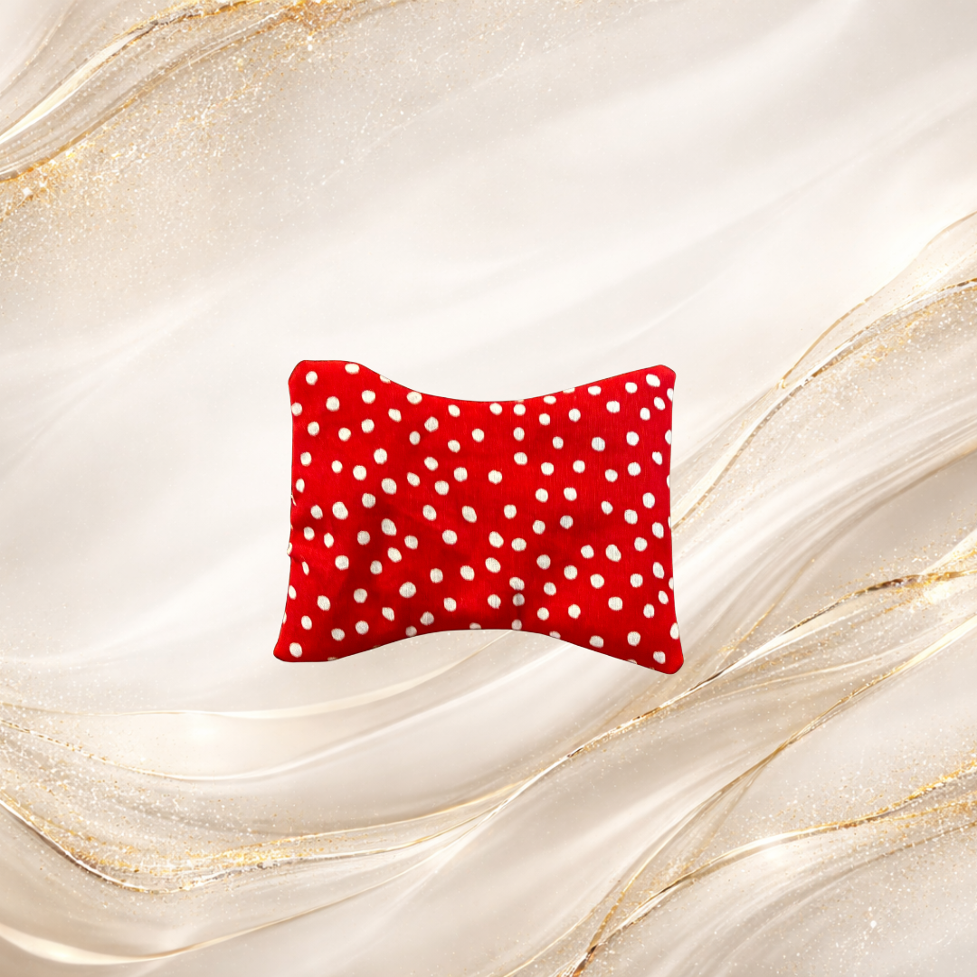 Small Palm & Pulse™ Comfort Compress in red with white dots, filled with premium buckwheat hulls, ideal for hand, wrist, or foot comfort.