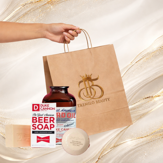 Tremilo Beauty “Oh Crap — For Him (Upgraded)” gift bundle including men’s soap, beard oil, and shower bomb in a kraft bag, displayed on a white and gold marble background.