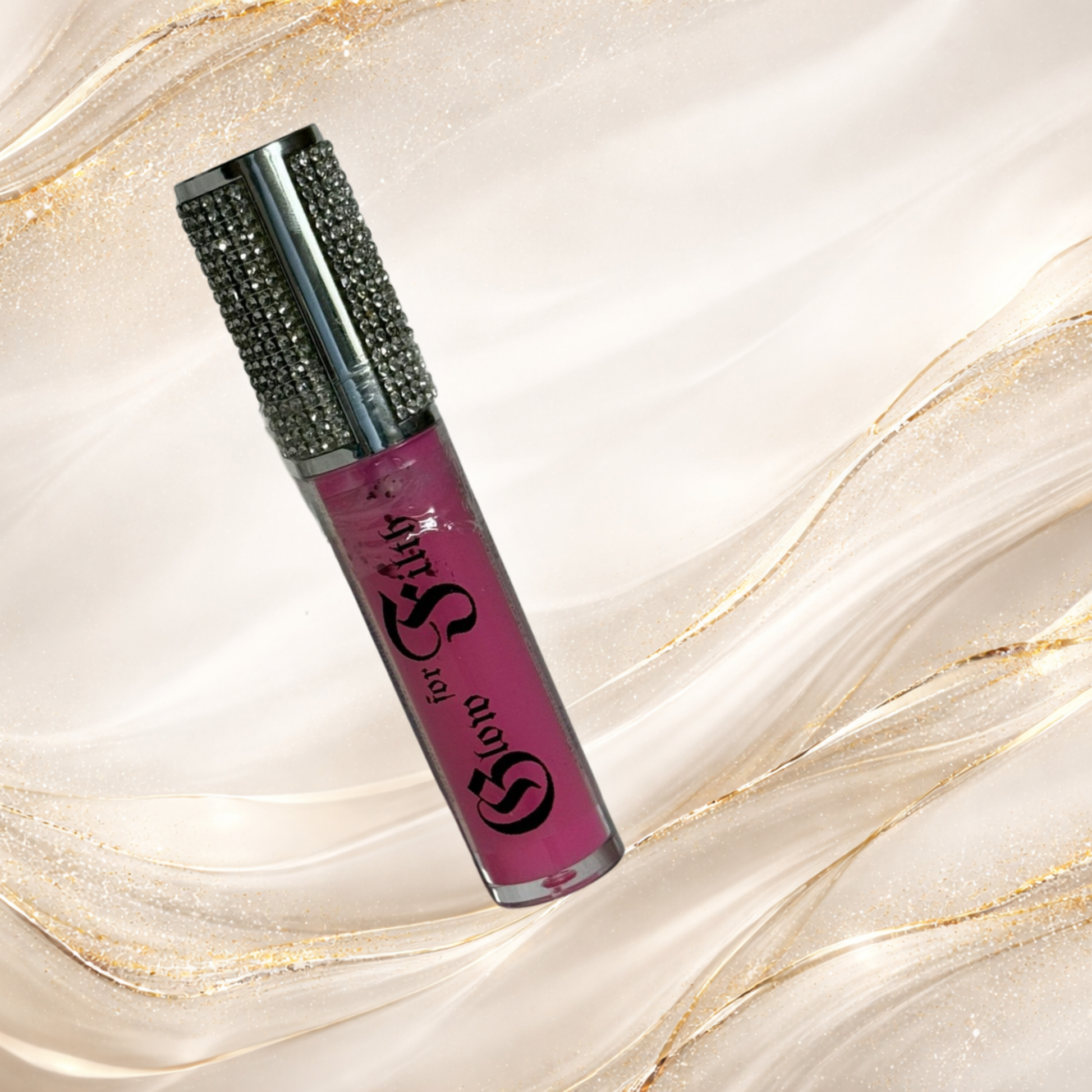 Bubblegum B lip gloss by Tremilo Beauty featuring vibrant pink gloss in a clear tube with rhinestone cap.