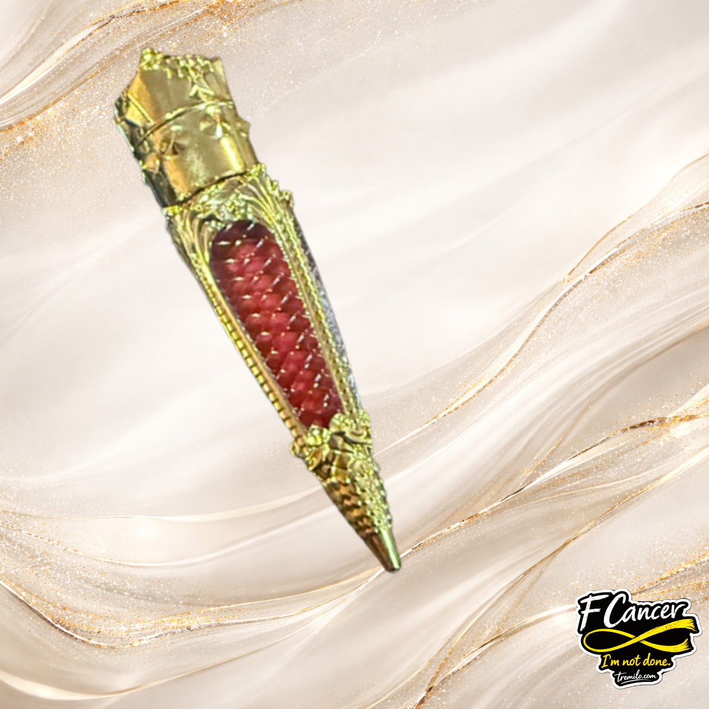 F Cancer lip gloss by Tremilo Beauty product shot showing red shade in decorative gold tube