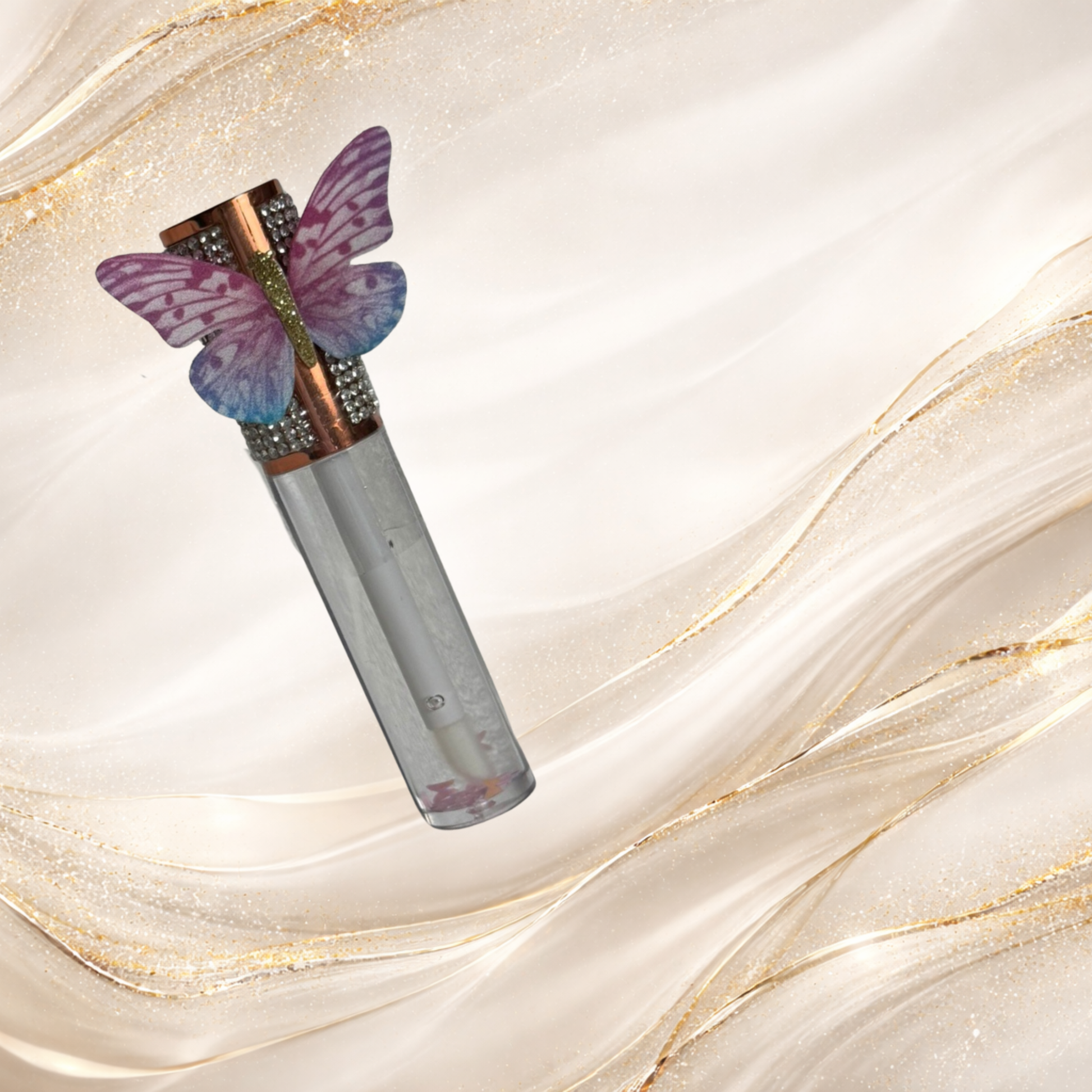 Flutterlight clear lip gloss with butterfly charm cap and floating star glitter – Tremilo Beauty.