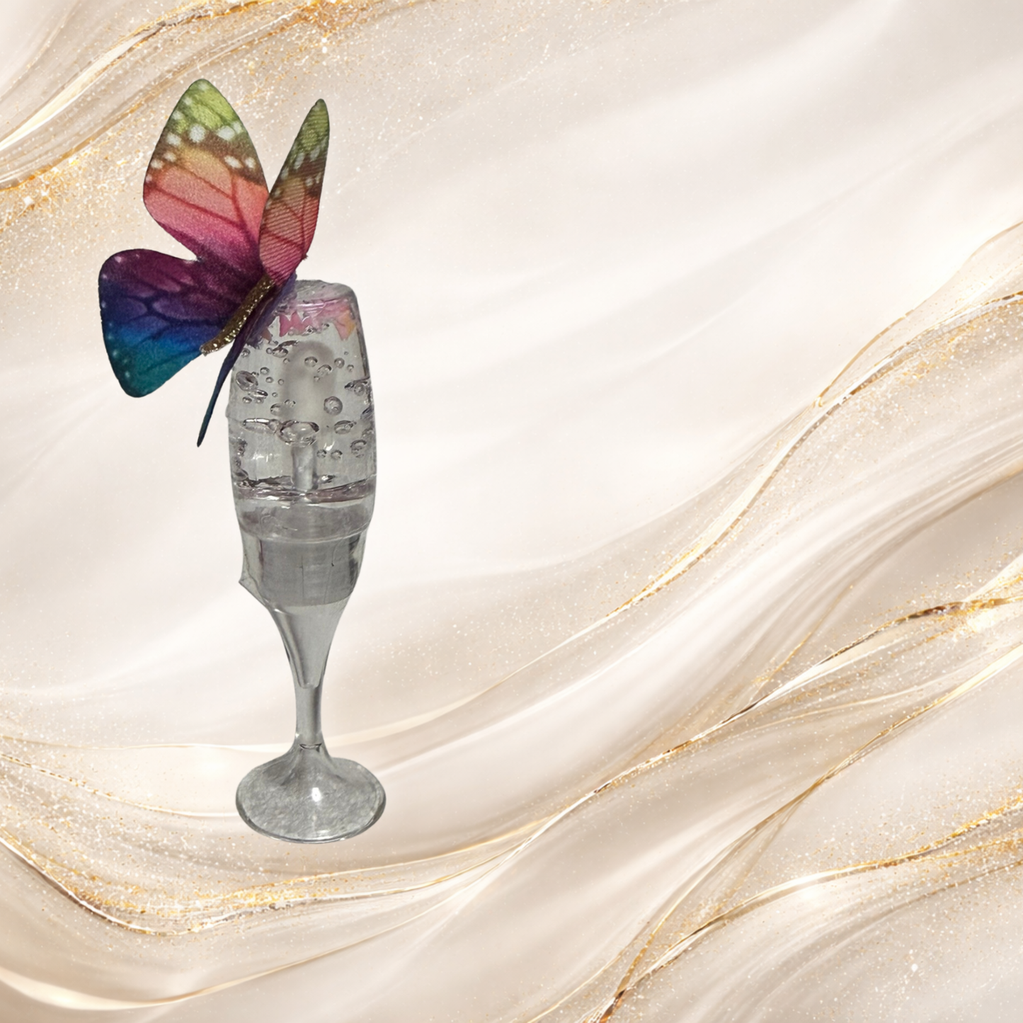 Flutterlight clear lip gloss in champagne glass display featuring rainbow butterfly charm topper.
