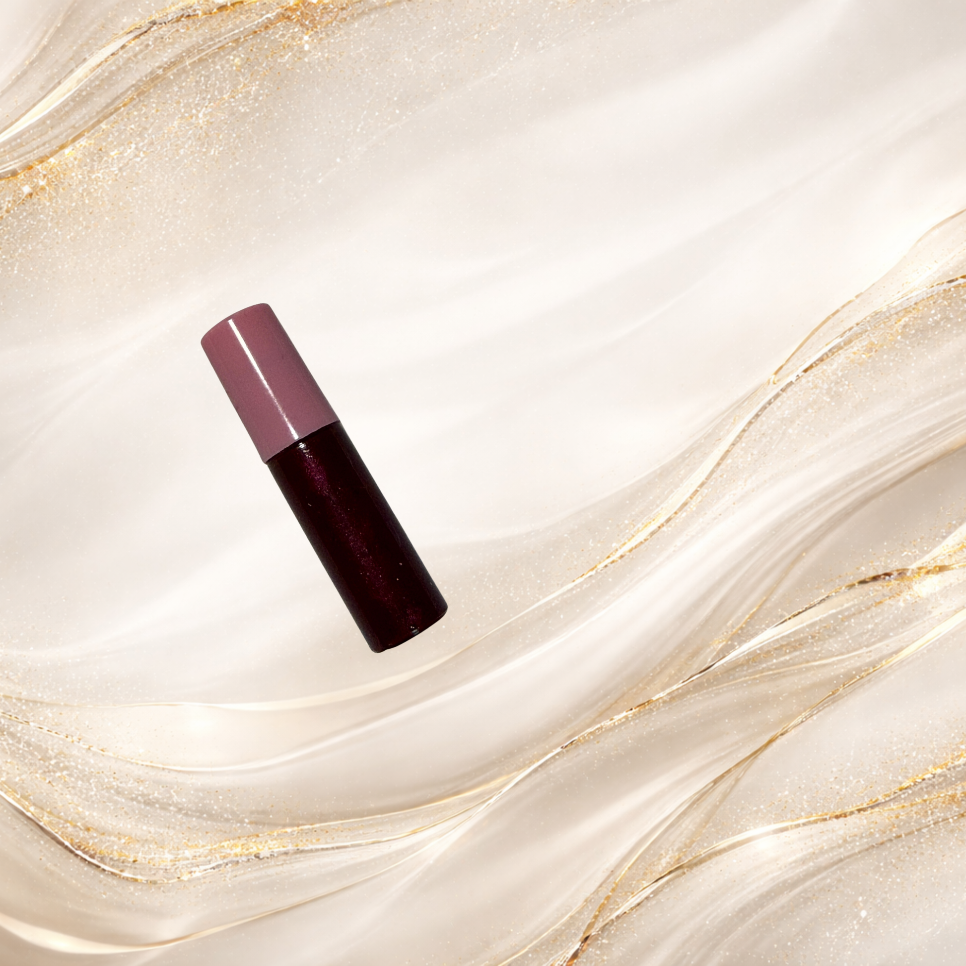 Mourningwould lip gloss product shot with pink cap showing dimensional red shimmer