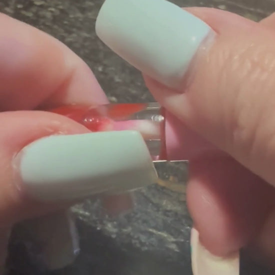 F Cancer lip gloss video by Tremilo Beauty featuring rich red shade and message of support for cancer patients