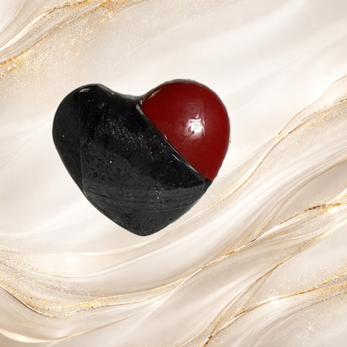 Black Gold heart-shaped lip gloss from Tremilo Beauty with black and red dual-tone design