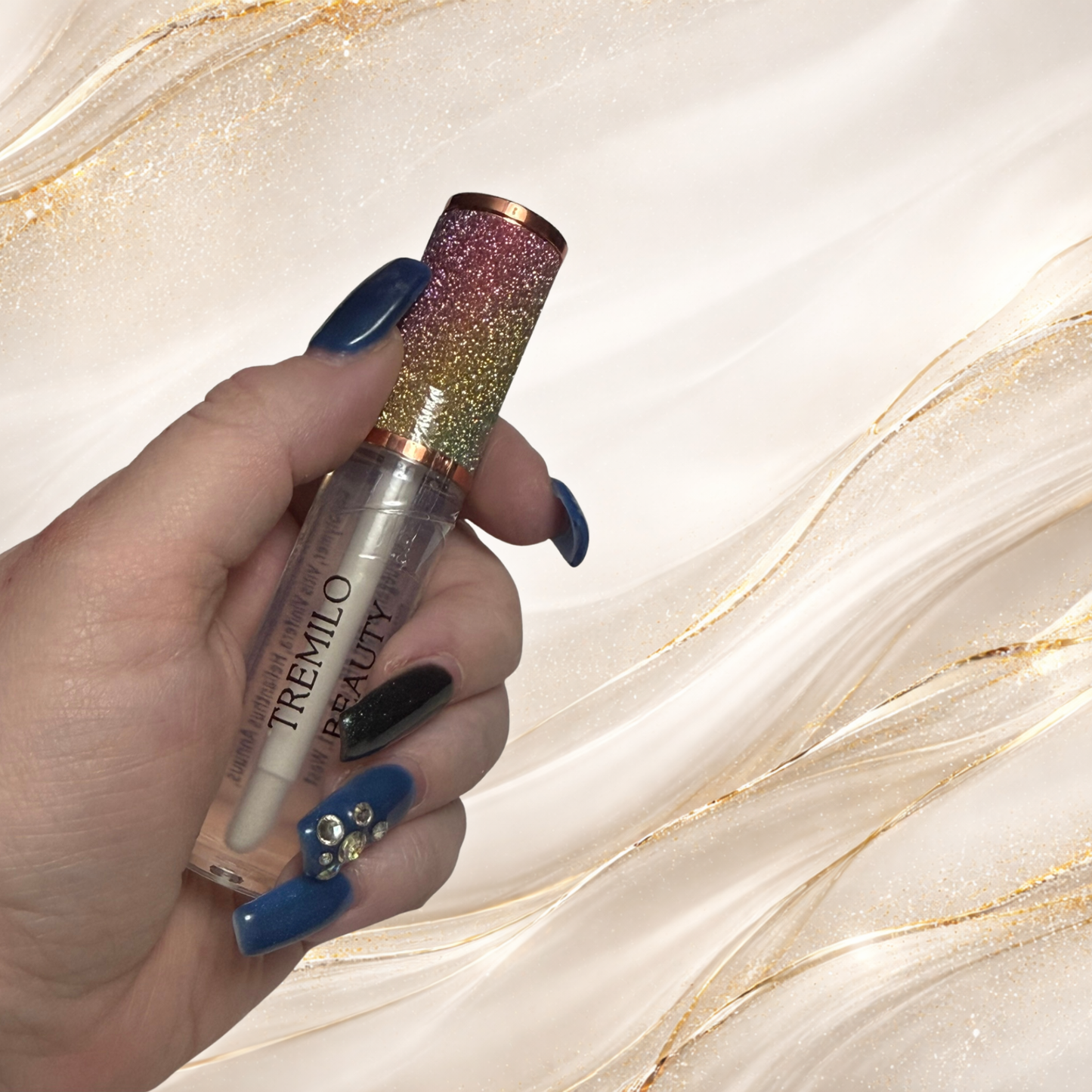 Hand holding Crystal Veil clear lip gloss tube from Tremilo Beauty Steel City Gloss collection