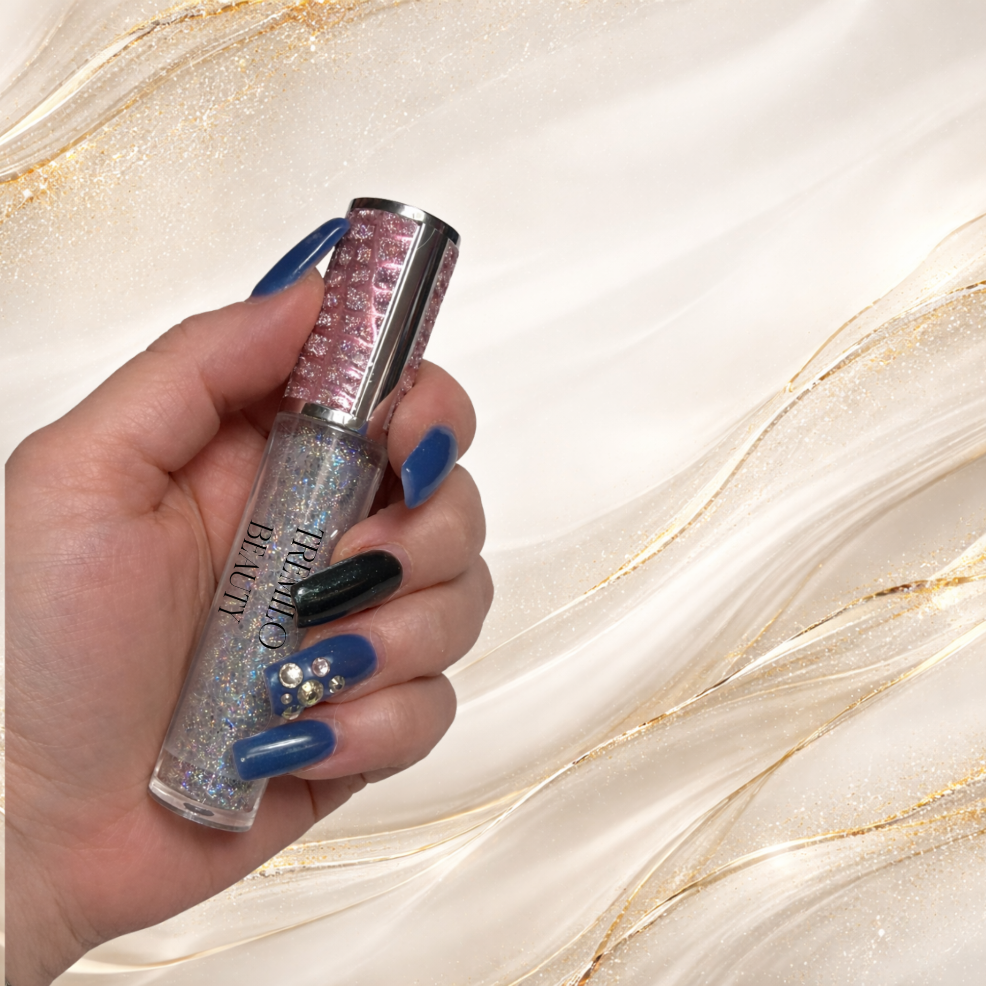 Tremilo Riveting holographic glitter lip gloss held in hand showing pink textured cap and sparkle formula
