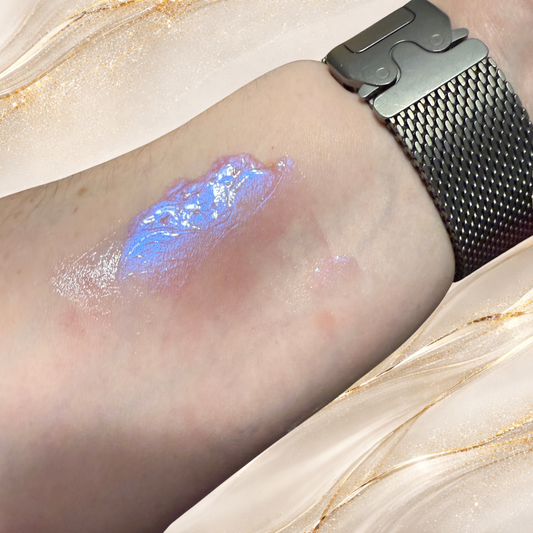 Violet Confluence lip gloss swatch showing pink gloss with violet-blue shimmer shift by Tremilo Beauty