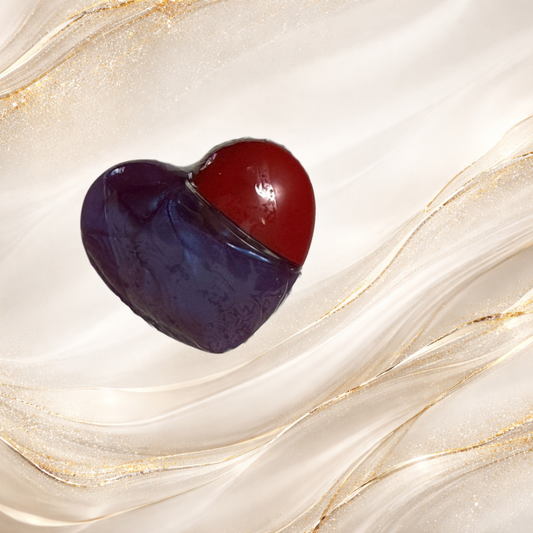 Violet Confluence purple lip gloss in heart shaped tube packaging from the Tremilo Steel City Gloss Collection.  Violet Confluence purple lip gloss inspired by Pittsburgh from the Tremilo Steel City Gloss Collection